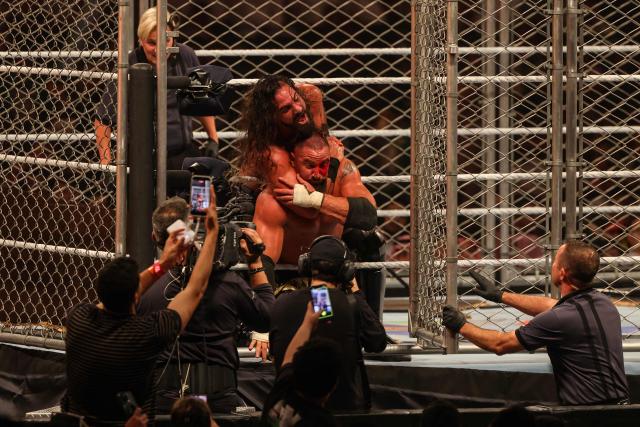 US wrestler Seth Rollins (back) and US wrestler Bron Breakker fight during the WWE Night of Champions wrestling event in Riyadh on June 27, 2026.  (Photo by Fayez NURELDINE / AFP)