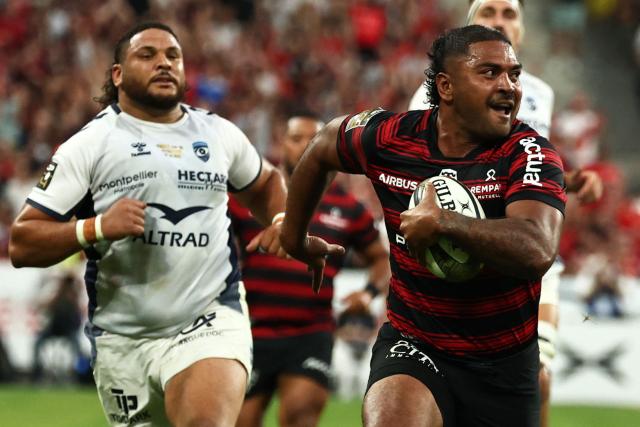 Toulouse's French hooker Peato Mauvaka runs to score a try during the French Top 14 rugby union final between Stade Toulousain (Toulouse) and Montpellier Hérault Rugby (MHR) at the Stade de France in Saint-Denis, on the outskirst of Paris, on June 27, 2026. (Photo by Anne-Christine POUJOULAT / AFP)