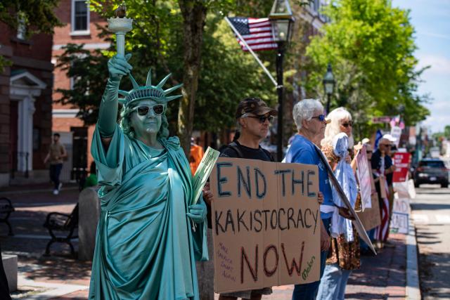 People participate in the "All of US" demonstration in Portsmouth, New Hampshire, on June 27, 2026. Activists are conducting a nationwide response to the planned events by the administration of US President Donald Trump to mark the 250th anniversary of the United States' Declaration of Independence. (Photo by JOSEPH PREZIOSO / AFP)