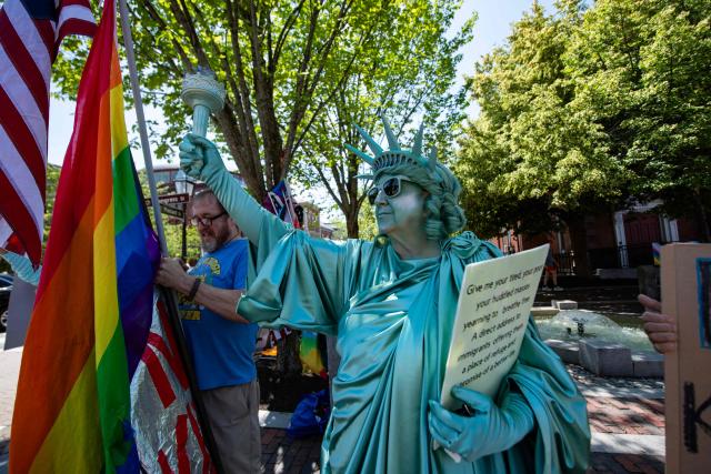 People participate in the "All of US" demonstration in Portsmouth, New Hampshire, on June 27, 2026. Activists are conducting a nationwide response to the planned events by the administration of US President Donald Trump to mark the 250th anniversary of the United States' Declaration of Independence. (Photo by JOSEPH PREZIOSO / AFP)