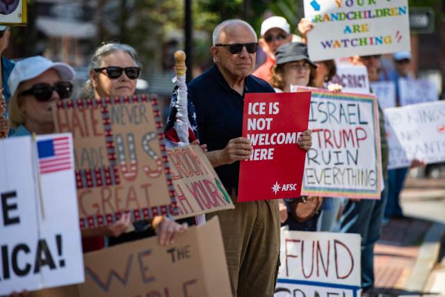 People participate in the "All of US" demonstration in Portsmouth, New Hampshire, on June 27, 2026. Activists are conducting a nationwide response to the planned events by the administration of US President Donald Trump to mark the 250th anniversary of the United States' Declaration of Independence. (Photo by JOSEPH PREZIOSO / AFP)