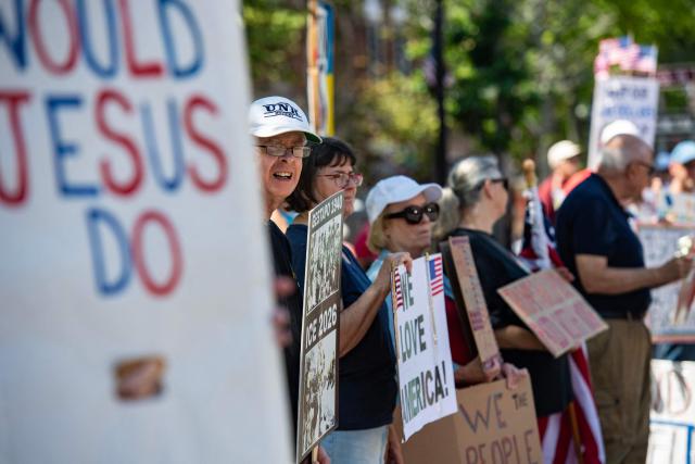 People participate in the "All of US" demonstration in Portsmouth, New Hampshire, on June 27, 2026. Activists are conducting a nationwide response to the planned events by the administration of US President Donald Trump to mark the 250th anniversary of the United States' Declaration of Independence. (Photo by JOSEPH PREZIOSO / AFP)