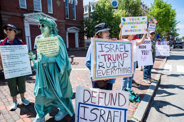 People participate in the "All of US" demonstration in Portsmouth, New Hampshire, on June 27, 2026. Activists are conducting a nationwide response to the planned events by the administration of US President Donald Trump to mark the 250th anniversary of the United States' Declaration of Independence. (Photo by JOSEPH PREZIOSO / AFP)