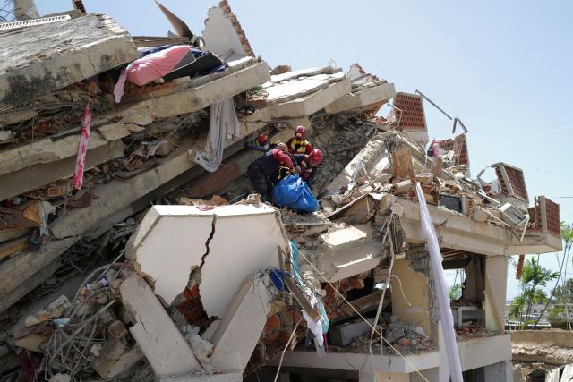Rescuers work on a collapsed building in Caraballeda, La Guaira state, Venezuela, on June 27, 2026, following earthquakes. Nearly 1,000 people have been killed and more than 50,000 remain missing after two consecutive earthquakes in Venezuela, where growing anger has been reported over the lack of official aid to swiftly rescue survivors. (Photo by Mauricio VALENZUELA / AFP)