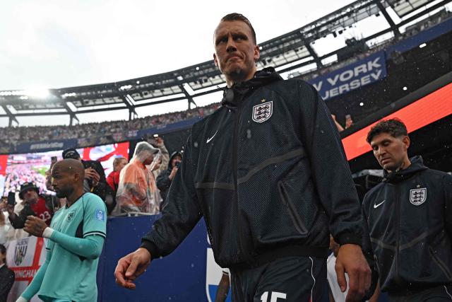 England's defender #15 Dan Burn walks onto the pitch ahead of the 2026 World Cup Group L football match between Panama and England at the New York/New Jersey Stadium in East Rutherford on June 27, 2026.  (Photo by MAURO PIMENTEL / AFP)