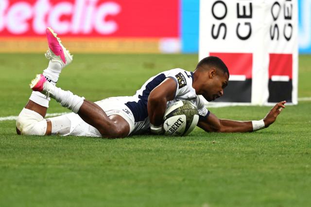 Montpellier’s French scrum?half Lйo Coly dives across the line to score a try during the French Top 14 rugby union final between Stade Toulousain (Toulouse) and Montpellier Hйrault Rugby (MHR) at the Stade de France in Saint-Denis, on the outskirts of Paris, on June 27, 2026. (Photo by Anne-Christine POUJOULAT / AFP)