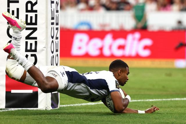 Montpellier’s French scrum?half Lйo Coly dives across the line to score a try during the French Top 14 rugby union final between Stade Toulousain (Toulouse) and Montpellier Hйrault Rugby (MHR) at the Stade de France in Saint-Denis, on the outskirts of Paris, on June 27, 2026. (Photo by Anne-Christine POUJOULAT / AFP)