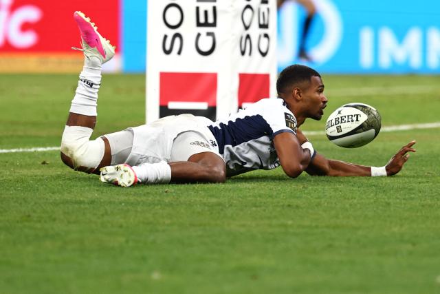 Montpellier’s French scrum?half Lйo Coly dives across the line to score a try during the French Top 14 rugby union final between Stade Toulousain (Toulouse) and Montpellier Hйrault Rugby (MHR) at the Stade de France in Saint-Denis, on the outskirts of Paris, on June 27, 2026. (Photo by Anne-Christine POUJOULAT / AFP)