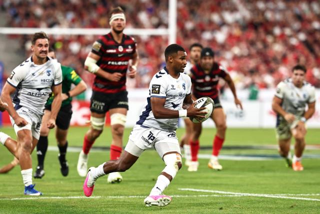 Montpellier’s French scrum-half Lйo Coly runs to score a try during the French Top 14 rugby union final between Stade Toulousain (Toulouse) and Montpellier Hйrault Rugby (MHR) at the Stade de France in Saint-Denis, on the outskirts of Paris, on June 27, 2026. (Photo by Anne-Christine POUJOULAT / AFP)
