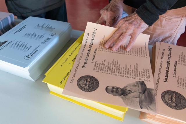People cast their vote at the polling station at the Salle Jean-Noyant during the provincial elections in the Motor Pool neighborhood of Noumea, New Caledonia, on June 28, 2026. (Photo by Delphine MAYEUR / AFP)