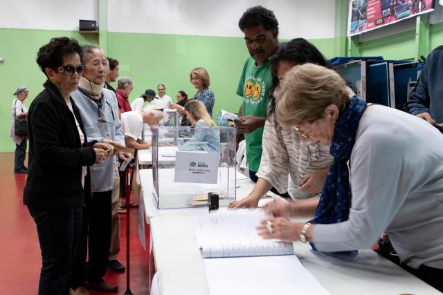 People cast their vote at the Jean-Noyant polling station in the Motor Pool neighborhood of Noumea in the French overseas territory of New Caledonia on June 28, 2026 during the archipelago's first provincial elections since 2019, after the vote was delayed three times as talks over the territory's political future stalled. The vote, initially planned for 2024, will determine the balance of power in New Caledonia ahead of fresh negotiations with France on the territory's future status. Three referendums on independence held in 2018, 2020 and 2021 returned majorities in favour of remaining part of France, although pro-independence groups boycotted the third vote, which was held during the Covid pandemic. (Photo by Delphine MAYEUR / AFP)