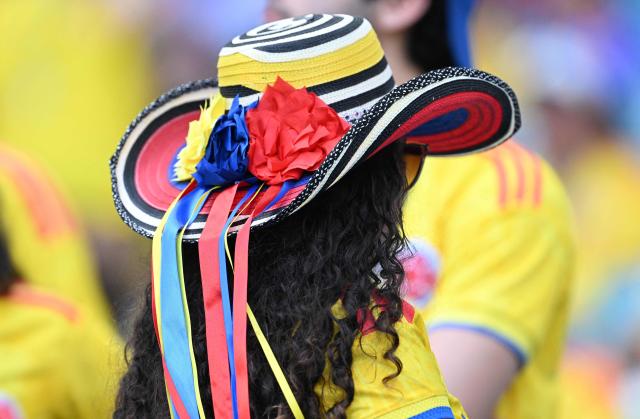 A Colombian fan wearing a traditional Colombian hat is pictured ahead of the 2026 World Cup Group K football match between Colombia and Portugal at the Miami Stadium in Miami Gardens on June 27, 2026.  (Photo by ROBERTO SCHMIDT / AFP)