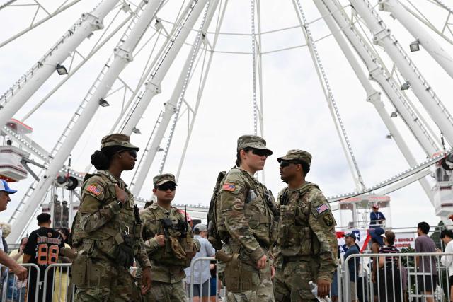 Members of the US Army National Guard patrol the “Great American State Fair" on the National Mall in Washington, DC, on June 27, 2026. "The Great American State Fair" is an exhibition of US traditions, its people and culture to celebrate the 250th anniversary of the United States' Declaration of Independence. (Photo by Alex WROBLEWSKI / AFP)