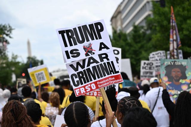 People march during a “Next250: A National Mobilization” rally in Washington, DC, on June 27, 2026. Activists are conducting a nationwide response to the planned events by the administration of US President Donald Trump to mark the 250th anniversary of the United States' Declaration of Independence. (Photo by Alex WROBLEWSKI / AFP)