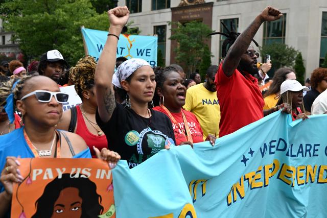 People march during a “Next250: A National Mobilization” rally in Washington, DC, on June 27, 2026. Activists are conducting a nationwide response to the planned events by the administration of US President Donald Trump to mark the 250th anniversary of the United States' Declaration of Independence. (Photo by Alex WROBLEWSKI / AFP)