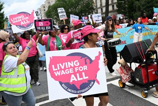 People march during a “Next250: A National Mobilization” rally in Washington, DC, on June 27, 2026. Activists are conducting a nationwide response to the planned events by the administration of US President Donald Trump to mark the 250th anniversary of the United States' Declaration of Independence. (Photo by Alex WROBLEWSKI / AFP)