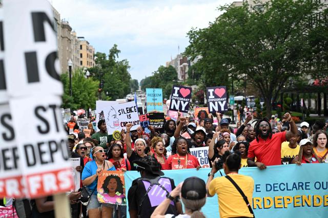People march during a “Next250: A National Mobilization” rally in Washington, DC, on June 27, 2026. Activists are conducting a nationwide response to the planned events by the administration of US President Donald Trump to mark the 250th anniversary of the United States' Declaration of Independence. (Photo by Alex WROBLEWSKI / AFP)