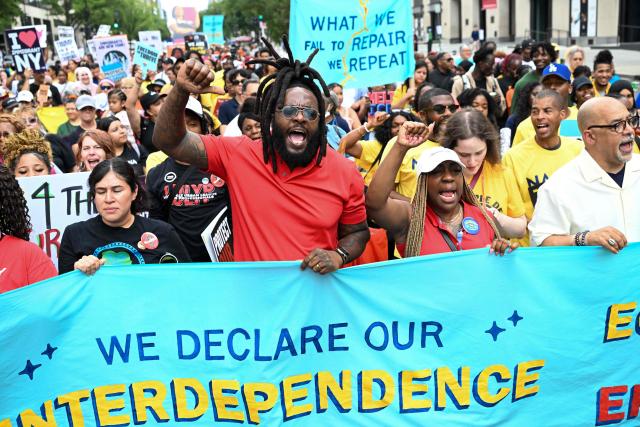 People march during a “Next250: A National Mobilization” rally in Washington, DC, on June 27, 2026. Activists are conducting a nationwide response to the planned events by the administration of US President Donald Trump to mark the 250th anniversary of the United States' Declaration of Independence. (Photo by Alex WROBLEWSKI / AFP)