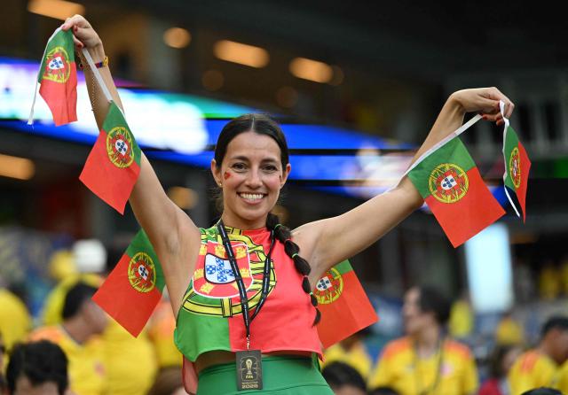 A Portuguese fan poses for a photo ahead of the 2026 World Cup Group K football match between Colombia and Portugal at the Miami Stadium in Miami Gardens on June 27, 2026.  (Photo by ROBERTO SCHMIDT / AFP)