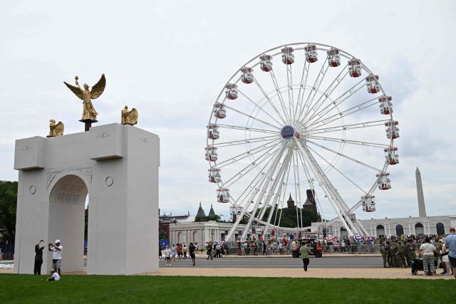 People attend the “Great American State Fair" on the National Mall in Washington, DC, on June 27, 2026. "The Great American State Fair" is an exhibition of US traditions, its people and culture to celebrate the 250th anniversary of the United States' Declaration of Independence. (Photo by Alex WROBLEWSKI / AFP)