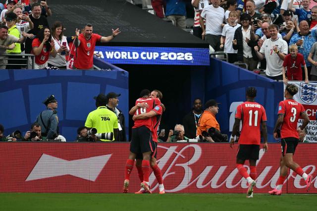 England's forward #09 Harry Kane (C) celebrates scoring his team's second goal with teammate midfielder #10 Jude Bellingham during the 2026 World Cup Group L football match between Panama and England at the New York/New Jersey Stadium in East Rutherford on June 27, 2026.  (Photo by MAURO PIMENTEL / AFP)