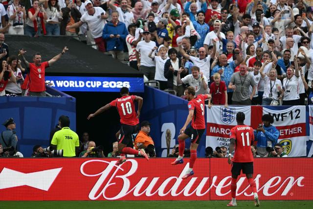 England's forward #09 Harry Kane (C) celebrates scoring his team's second goal with teammate midfielder #10 Jude Bellingham during the 2026 World Cup Group L football match between Panama and England at the New York/New Jersey Stadium in East Rutherford on June 27, 2026.  (Photo by MAURO PIMENTEL / AFP)