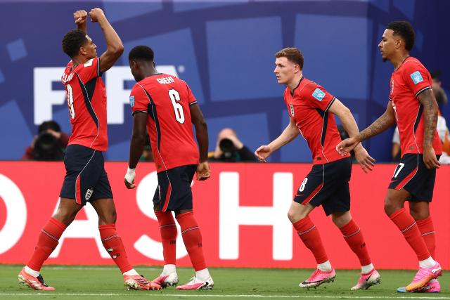 England's midfielder #10 Jude Bellingham (L) celebrates scoring his team's first goal during the 2026 World Cup Group L football match between Panama and England at the New York/New Jersey Stadium in East Rutherford on June 27, 2026.  (Photo by CHARLY TRIBALLEAU / AFP)