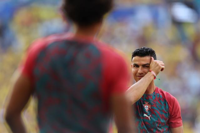 Portugal's forward #07 Cristiano Ronaldo gestures as he takes part in the warm-up ahead of the 2026 World Cup Group K football match between Colombia and Portugal at the Miami Stadium in Miami Gardens on June 27, 2026.  (Photo by PATRICIA DE MELO MOREIRA / AFP)
