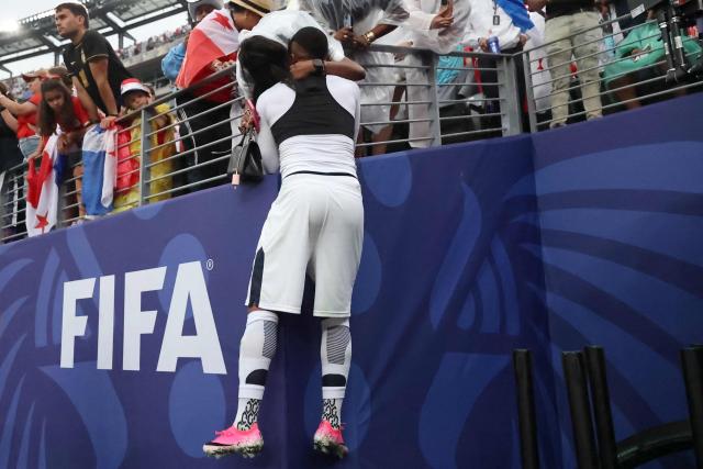 Panama's forward #18 Cecilio Waterman embraces a relative at the end of the 2026 World Cup Group L football match between Panama and England at the New York/New Jersey Stadium in East Rutherford on June 27, 2026.  (Photo by FRANCK FIFE / AFP)