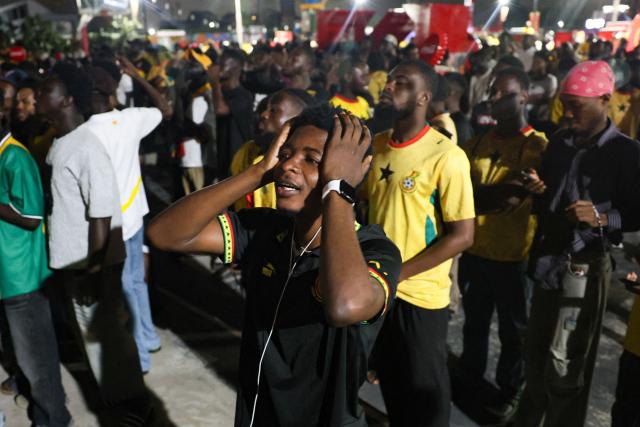 Ghanian football supporters react as they watch a live broadcast of the 2026 FIFA World Cup match between Ghana and Croatia in Accra on June 27, 2026. (Photo by Nipah Dennis / AFP)