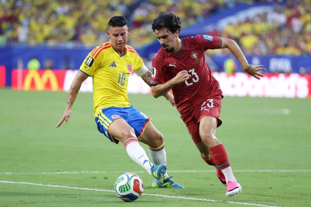 Colombia's midfielder #10 James Rodriguez and Portugal's midfielder #23 Vitinha fight for the ball during the 2026 World Cup Group K football match between Colombia and Portugal at the Miami Stadium in Miami Gardens on June 27, 2026.  (Photo by PATRICIA DE MELO MOREIRA / AFP)
