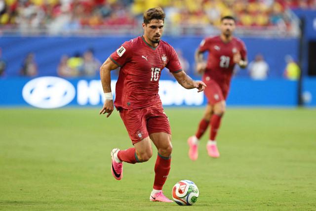 Portugal's forward #18 Pedro Neto runs with the ball during the 2026 World Cup Group K football match between Colombia and Portugal at the Miami Stadium in Miami Gardens on June 27, 2026.  (Photo by ROBERTO SCHMIDT / AFP)