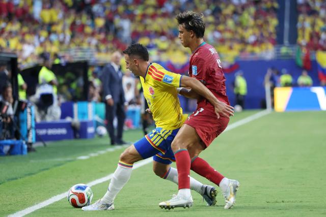 Colombia's defender #04 Santiago Arias (L) and Portugal's forward #11 Joao Felix (R) fight for the ball during the 2026 World Cup Group K football match between Colombia and Portugal at the Miami Stadium in Miami Gardens on June 27, 2026.  (Photo by PATRICIA DE MELO MOREIRA / AFP)