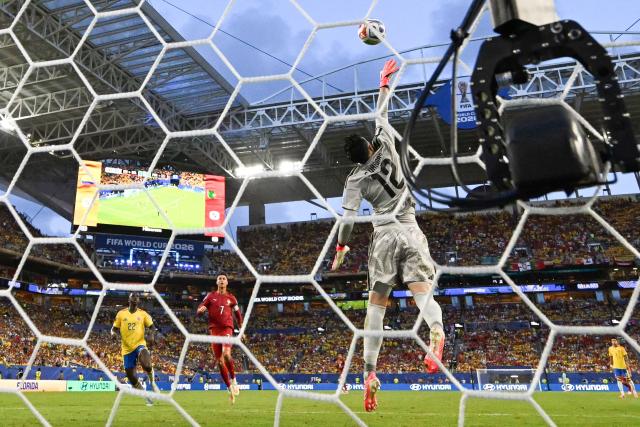 Colombia's goalkeeper #12 Camilo Vargas makes a save past Portugal's forward #07 Cristiano Ronaldo and Colombia's defender #22 Deiver Machado during the 2026 World Cup Group K football match between Colombia and Portugal at the Miami Stadium in Miami Gardens on June 27, 2026.  (Photo by CHANDAN KHANNA / AFP)