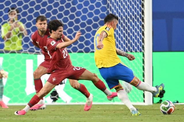 Colombia's midfielder #10 James Rodriguez kicks the ball past Portugal's midfielder #23 Vitinha during the 2026 World Cup Group K football match between Colombia and Portugal at the Miami Stadium in Miami Gardens on June 27, 2026.  (Photo by ROBERTO SCHMIDT / AFP)