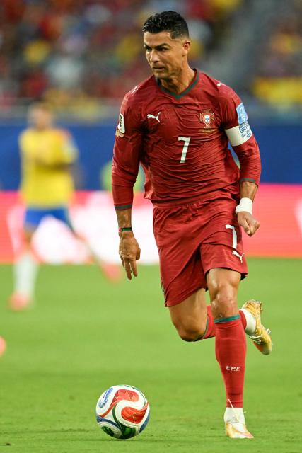 Portugal's forward #07 Cristiano Ronaldo runs with the ball during the 2026 World Cup Group K football match between Colombia and Portugal at the Miami Stadium in Miami Gardens on June 27, 2026.  (Photo by CHANDAN KHANNA / AFP)