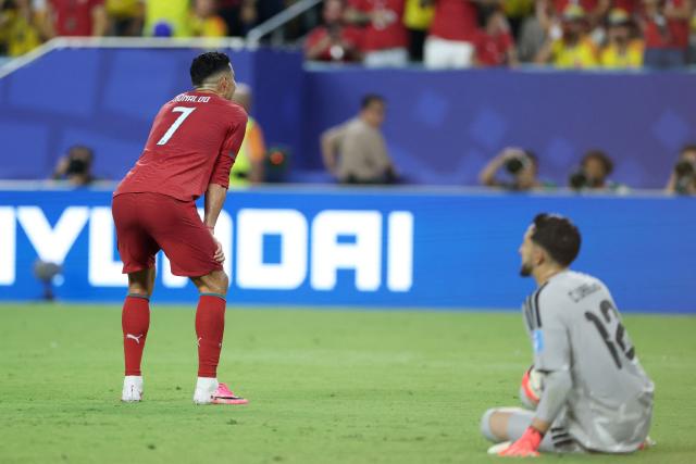 Portugal's forward #07 Cristiano Ronaldo reacts to a missed chance past Colombia's goalkeeper #12 Camilo Vargas during the 2026 World Cup Group K football match between Colombia and Portugal at the Miami Stadium in Miami Gardens on June 27, 2026.  (Photo by PATRICIA DE MELO MOREIRA / AFP)