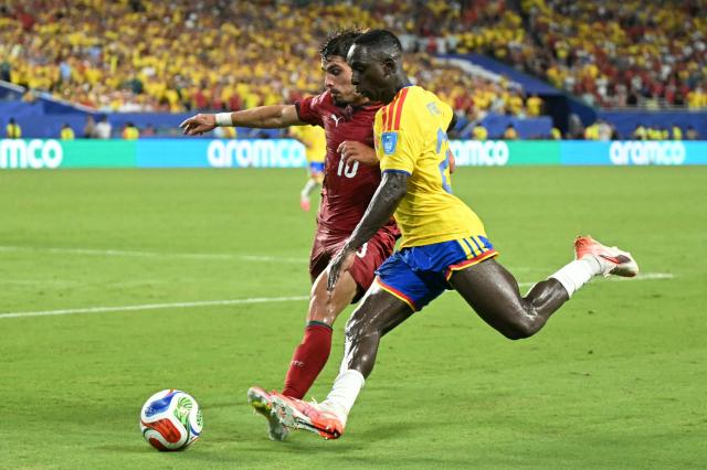 Colombia's defender #22 Deiver Machado (R) and Portugal's forward #18 Pedro Neto fight for the ball during the 2026 World Cup Group K football match between Colombia and Portugal at the Miami Stadium in Miami Gardens on June 27, 2026.  (Photo by CHANDAN KHANNA / AFP)