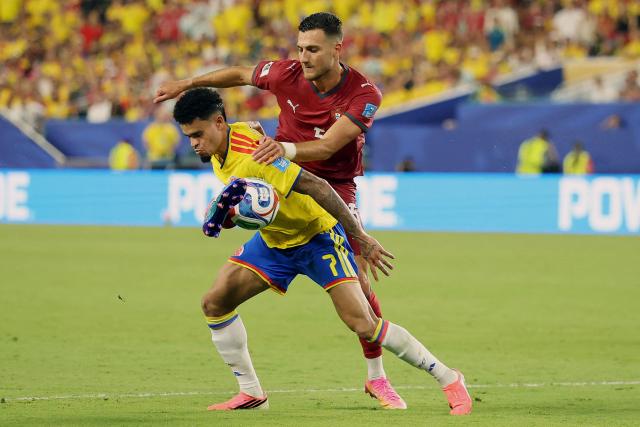 Colombia's forward #07 Luis Diaz and Portugal's defender #05 Diogo Dalot fight for the ball during the 2026 World Cup Group K football match between Colombia and Portugal at the Miami Stadium in Miami Gardens on June 27, 2026.  (Photo by PATRICIA DE MELO MOREIRA / AFP)