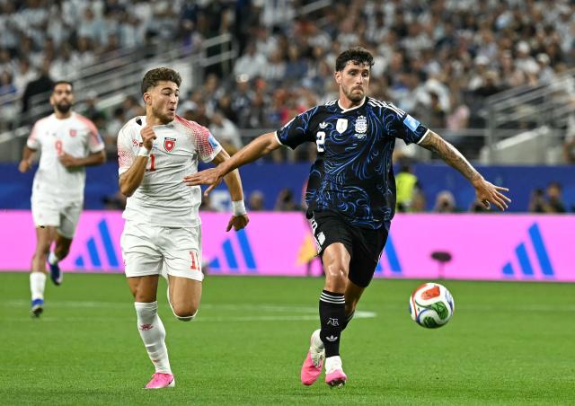 Jordan's forward #11 Odeh Fakhoury and Argentina's defender #02 Marcos Senesi fight for the ball during the 2026 World Cup Group J football match between Jordan and Argentina at the Dallas Stadium in Arlington on June 27, 2026.  (Photo by Paul ELLIS / AFP)