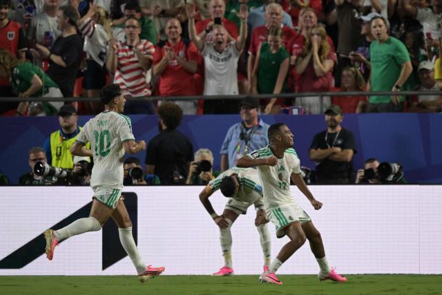 Algeria's defender #17 Rafik Belghali celebrates scoring his team's first goal during the 2026 World Cup Group J football match between Algeria and Austria at the Kansas City Stadium in Kansas City on June 27, 2026.  (Photo by JUAN MABROMATA / AFP)