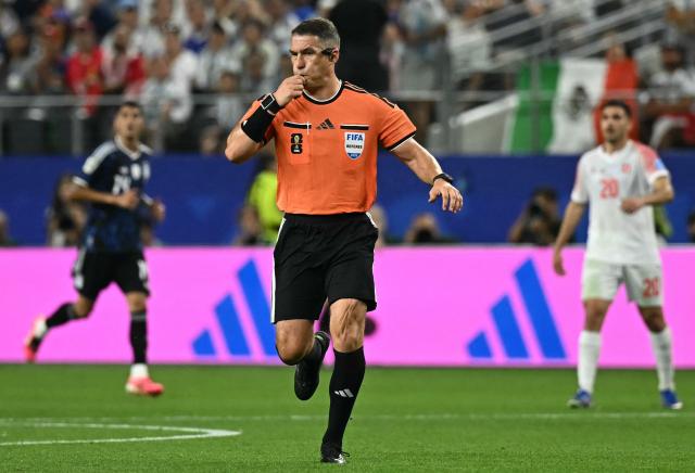Romanian referee Istvan Kovacs gestures during the 2026 World Cup Group J football match between Jordan and Argentina at the Dallas Stadium in Arlington on June 27, 2026.  (Photo by Paul ELLIS / AFP)