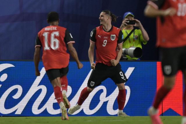 Austria's midfielder #09 Marcel Sabitzer celebrates after scoring his team's second goal during the 2026 World Cup Group J football match between Algeria and Austria at the Kansas City Stadium in Kansas City on June 27, 2026.  (Photo by JUAN MABROMATA / AFP)
