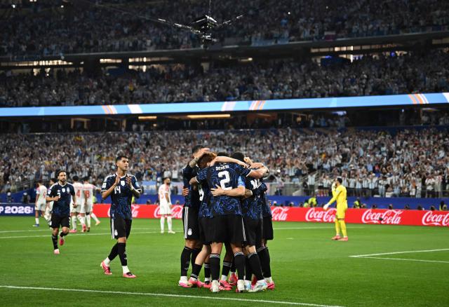 Argentina's forward #10 Lionel Messi (unseen) celebrates with teammates scoring his team's third goal during the 2026 World Cup Group J football match between Jordan and Argentina at the Dallas Stadium in Arlington on June 27, 2026.  (Photo by Paul ELLIS / AFP)