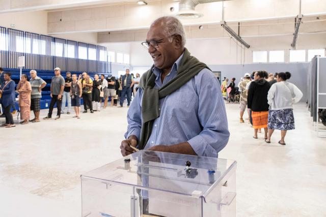 Walles Kotra, lead candidate of the "Une Province Pour Tous, Un Pays Solidaire, Un Avenir Partage" list, casts his ballot at the Veyret-Kafoa polling station during New Caledonia's provincial elections in the Riviere Salee neighbourhood of Noumea, New Caledonia, on June 28, 2026. (Photo by Delphine MAYEUR / AFP)