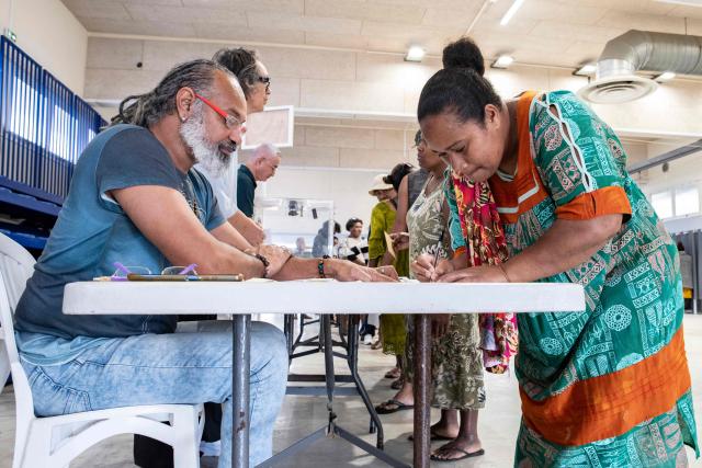 People vote at the Veyret-Kafoa polling station during New Caledonia's provincial elections in the Riviere Salee neighbourhood of Noumea, New Caledonia, on June 28, 2026. (Photo by Delphine MAYEUR / AFP)