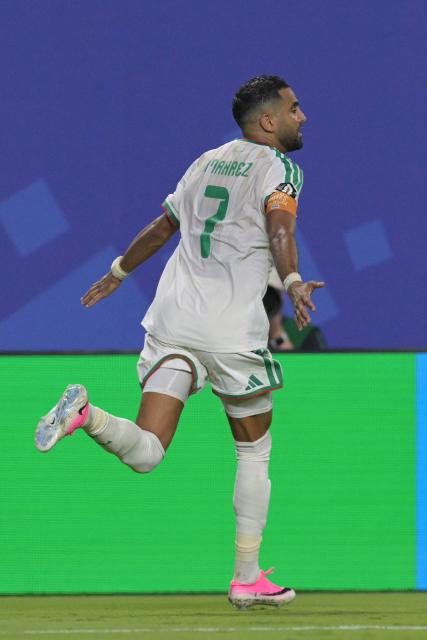 Algeria's forward #7 Riyad Mahrez celebrates after scoring his team's third goal during the 2026 World Cup Group J football match between Algeria and Austria at the Kansas City Stadium in Kansas City on June 27, 2026.  (Photo by JUAN MABROMATA / AFP)
