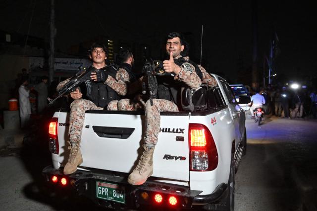 Security personnel leave the Mosamiat Chowrangi area in Karachi on June 28, 2026, at the end of a clearance operation following an alleged explosion and a militant attack. Heavy gunfire was heard in Pakistan's southern megacity Karachi on June 27 evening, AFP journalists said, following reports of an explosion. (Photo by Asif HASSAN / AFP)