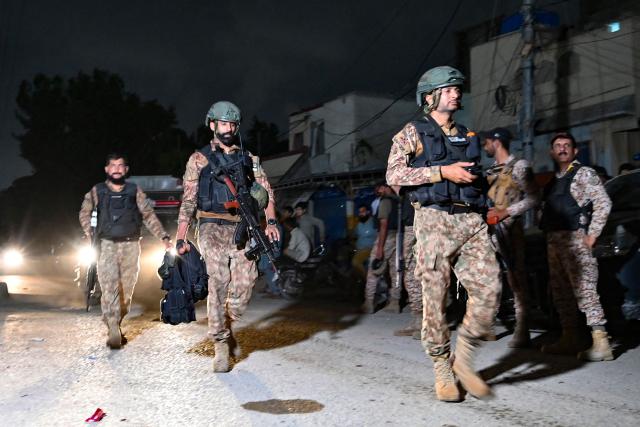 Security personnel leave the Mosamiat Chowrangi area in Karachi on June 28, 2026, at the end of a clearance operation following an alleged explosion and a militant attack. Heavy gunfire was heard in Pakistan's southern megacity Karachi on June 27 evening, AFP journalists said, following reports of an explosion. (Photo by Asif HASSAN / AFP)