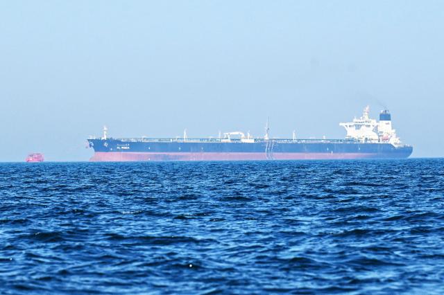 The 'Al-Riqqa' oil tanker sails in the Arabian Gulf waters, off the coast of  Kuwait City on June 27, 2026. Kuwait came under attack from "hostile" missiles and drones, the country's army said on June 28, while in Bahrain air-raid sirens sounded following fresh US strikes against Iran. (Photo by YASSER AL-ZAYYAT / AFP) / 